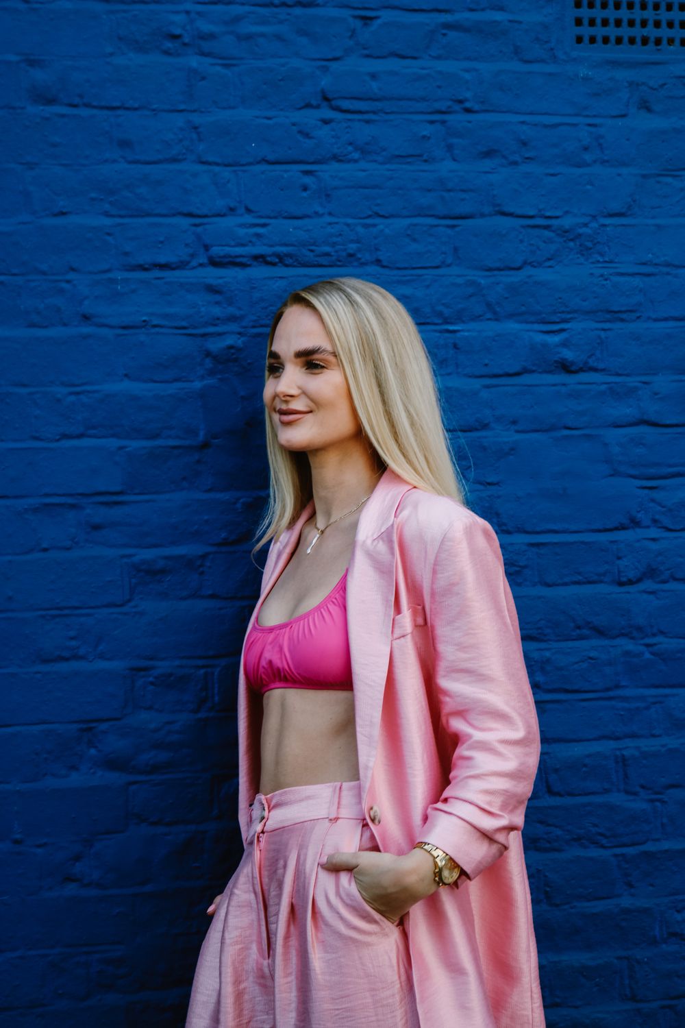 Model in a pink tailored suit