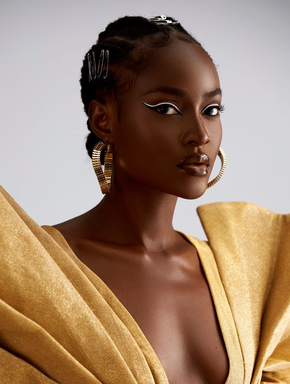 Portrait of a model with gold styling