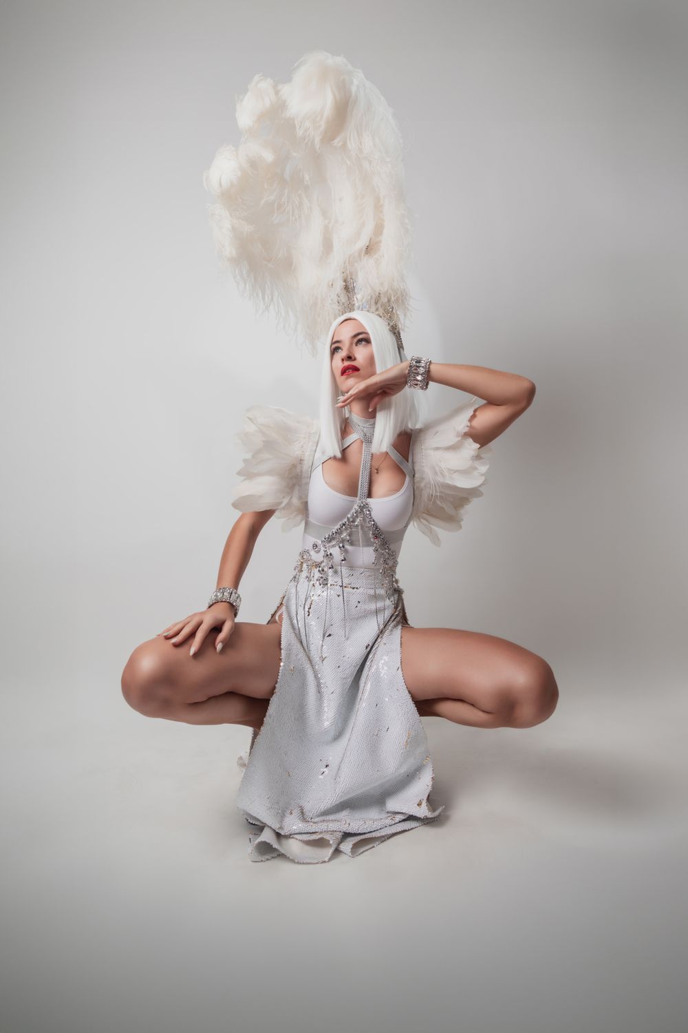 Performer in a white feather headdress